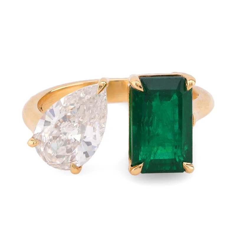 Solitaire diamond engagement ring with a platinum setting for a classic and elegant lookVintage 2.33 Carat Emerald Diamond 18K Yellow Gold Toi Et Moi Ring