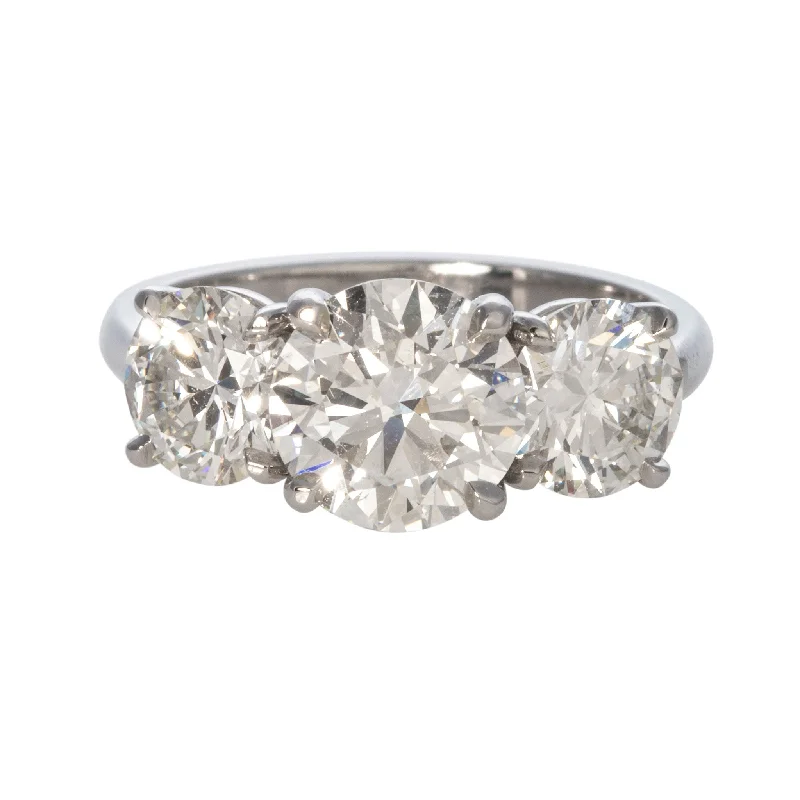 Cathedral - Style Women's Diamond Rings with a Raised Center Setting and Elaborate Metalwork4ctw Round Brilliant Diamond Three-Stone Platinum Engagement Ring