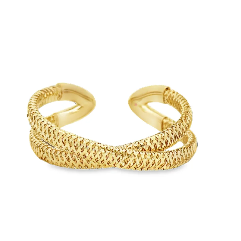 Ruby and diamond engagement ring with a halo of diamonds in 14K red goldRoberto Coin Flexible Criss-cross Bangle Bracelet in 18k Yellow Gold Ruby and diamond engagement ring with a halo of diamonds in 14K red goldRoberto Coin Flexible Criss-cross Bangle Bracelet in 18k Yellow Gold