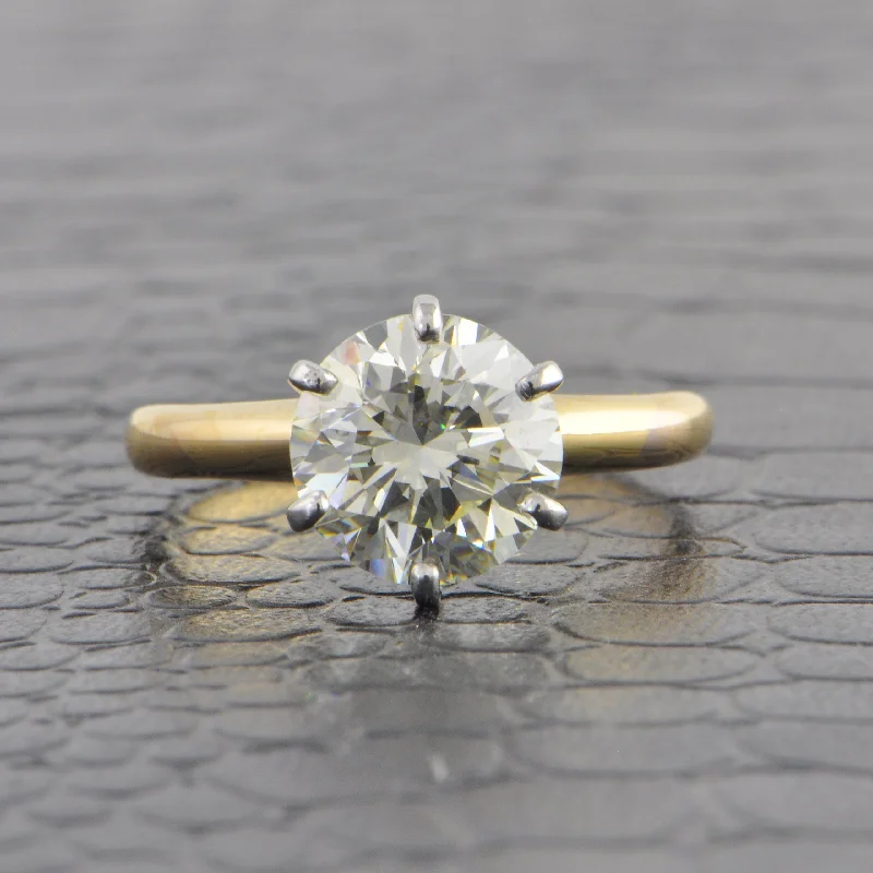 Pear - shaped diamond engagement ring with side baguette diamonds in 18K goldGIA 3.05 ct. M-VS2 Round Brilliant Cut Diamond Engagement Ring in Yellow Gold
