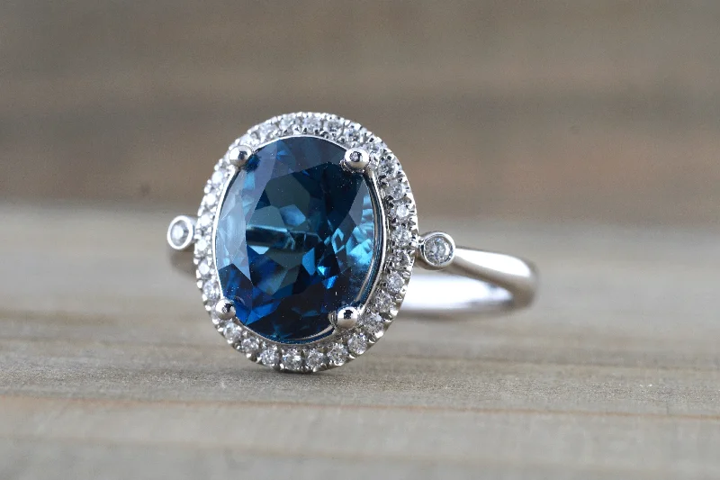 Men's budget - friendly rings for cost - conscious shoppers10x8mm London Blue Topaz Oval Diamond Halo Ring M3095 Men's budget - friendly rings for cost - conscious shoppers10x8mm London Blue Topaz Oval Diamond Halo Ring M3095
