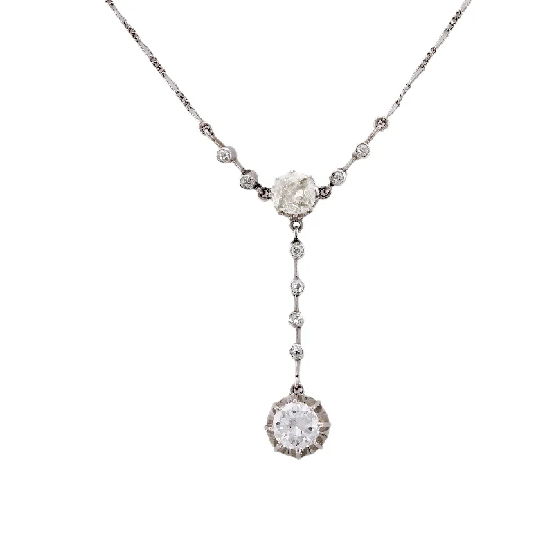 Radiant - cut diamond engagement ring with a bezel - set center stone in 18K yellow goldEdwardian 2.75 Carat Total Diamond Weight Platinum Lariat Necklace Radiant - cut diamond engagement ring with a bezel - set center stone in 18K yellow goldEdwardian 2.75 Carat Total Diamond Weight Platinum Lariat Necklace