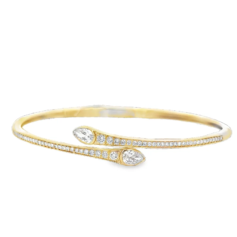 Opal and diamond engagement ring in a contemporary silver band with black - rhodium accentsPear Cut Diamond Bangle Bracelet in Yellow Gold Opal and diamond engagement ring in a contemporary silver band with black - rhodium accentsPear Cut Diamond Bangle Bracelet in Yellow Gold
