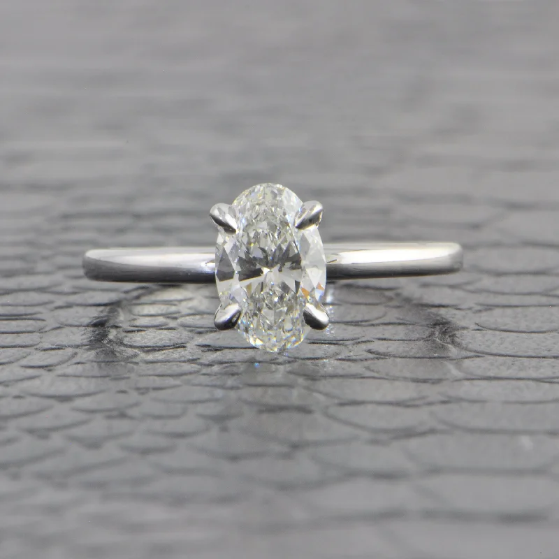 Aquamarine and diamond engagement ring in a 18K white - gold setting with a scalloped edgeGIA 1.08 F-SI1 Oval Cut Diamond Engagement Ring in White Gold Aquamarine and diamond engagement ring in a 18K white - gold setting with a scalloped edgeGIA 1.08 F-SI1 Oval Cut Diamond Engagement Ring in White Gold
