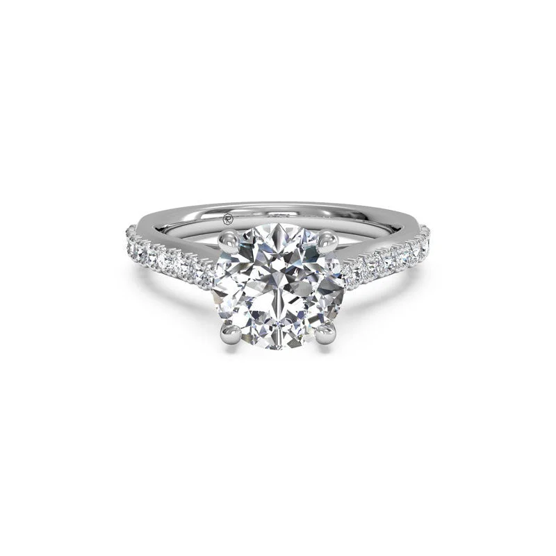 Men's Tanzanite Engagement Rings in Palladium with a Three - Stone ArrangementFrench-Set Surprise Diamond Round Diamond Engagement Ring