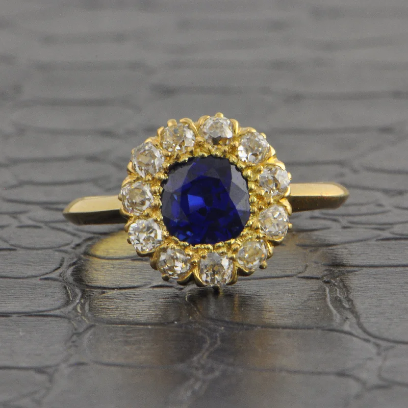 Aquamarine and diamond engagement ring in a 18K white - gold setting with a scalloped edgeAntique Edwardian Sapphire and Old Mine Cut Diamond Cluster Ring in 18k Yellow Gold Aquamarine and diamond engagement ring in a 18K white - gold setting with a scalloped edgeAntique Edwardian Sapphire and Old Mine Cut Diamond Cluster Ring in 18k Yellow Gold