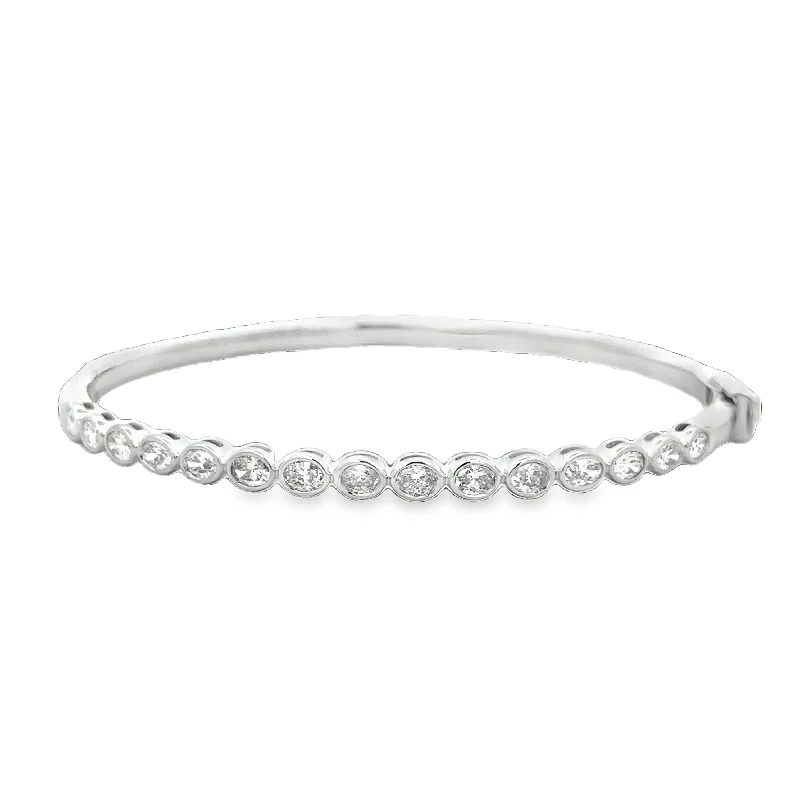 Three - stone diamond engagement ring in rose gold, symbolizing past, present, and futureOval Diamond Bangle Bracelet in White Gold Three - stone diamond engagement ring in rose gold, symbolizing past, present, and futureOval Diamond Bangle Bracelet in White Gold