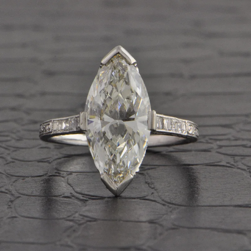 Radiant - cut diamond engagement ring with a bezel - set center stone in 18K yellow goldAntique Art Deco 4.09 ct. Marquise Cut Diamond Engagement Ring in Platinum Radiant - cut diamond engagement ring with a bezel - set center stone in 18K yellow goldAntique Art Deco 4.09 ct. Marquise Cut Diamond Engagement Ring in Platinum