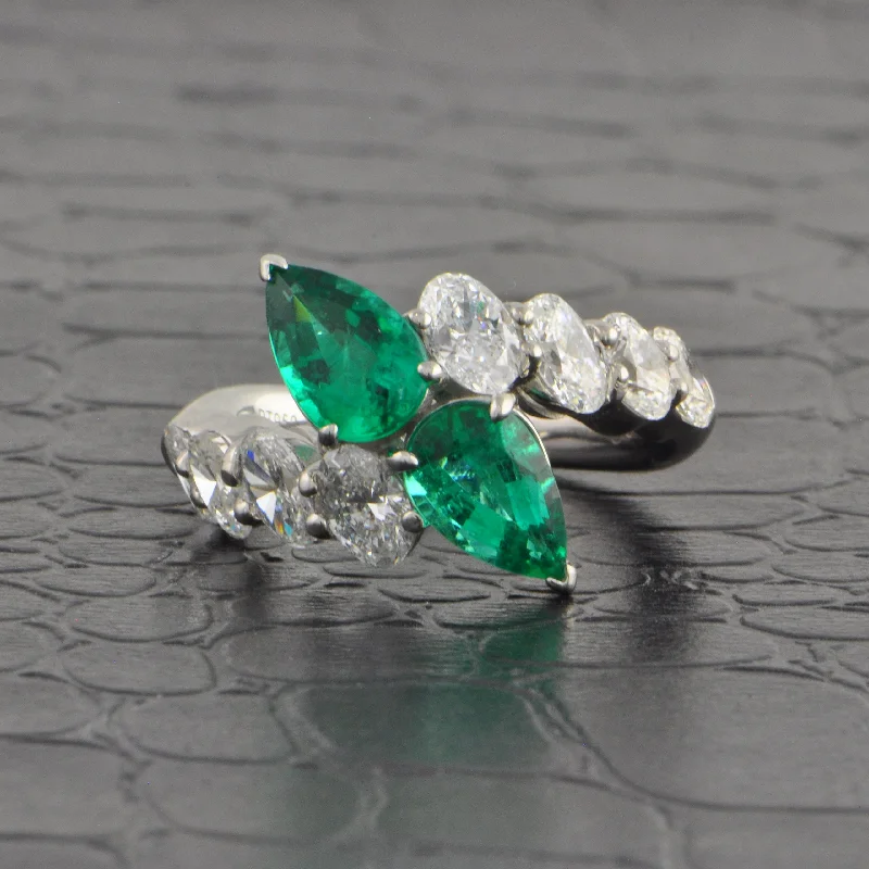Aquamarine and diamond engagement ring in a 18K white - gold setting with a scalloped edgeEmerald and Diamond Toi et Moi Bypass Ring in Platinum Aquamarine and diamond engagement ring in a 18K white - gold setting with a scalloped edgeEmerald and Diamond Toi et Moi Bypass Ring in Platinum