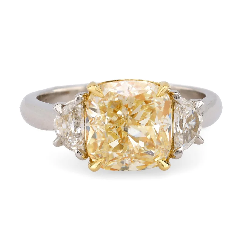 Solitaire diamond engagement ring with a platinum setting for a classic and elegant lookModern 3.08 Carat EGL Fancy Yellow Diamond Platinum Three Stone Ring