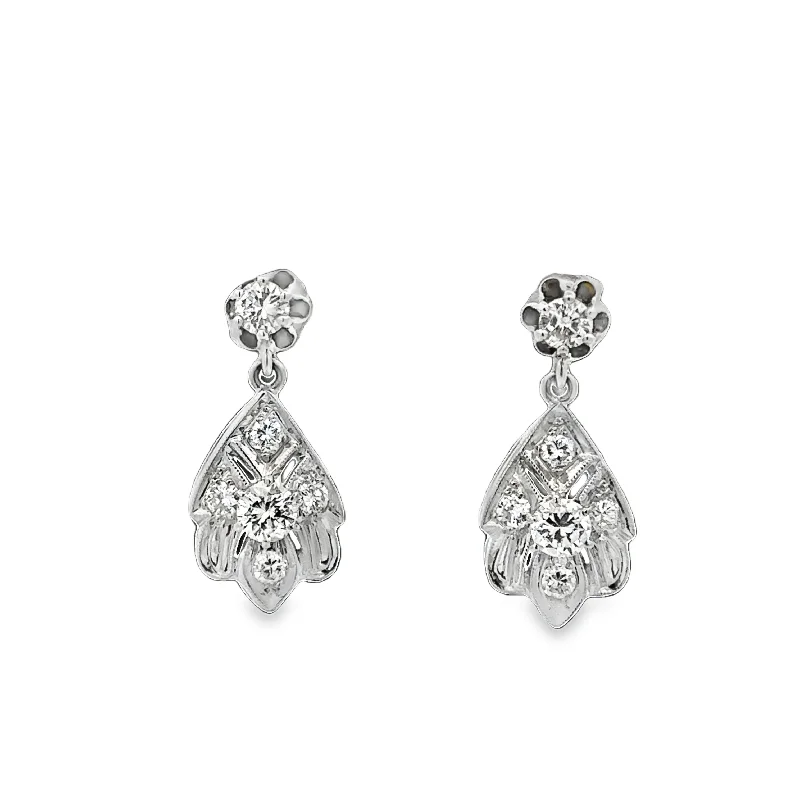 Emerald and diamond engagement ring in a vintage - inspired platinum bandVintage Diamond Drop Earrings in White Gold Emerald and diamond engagement ring in a vintage - inspired platinum bandVintage Diamond Drop Earrings in White Gold